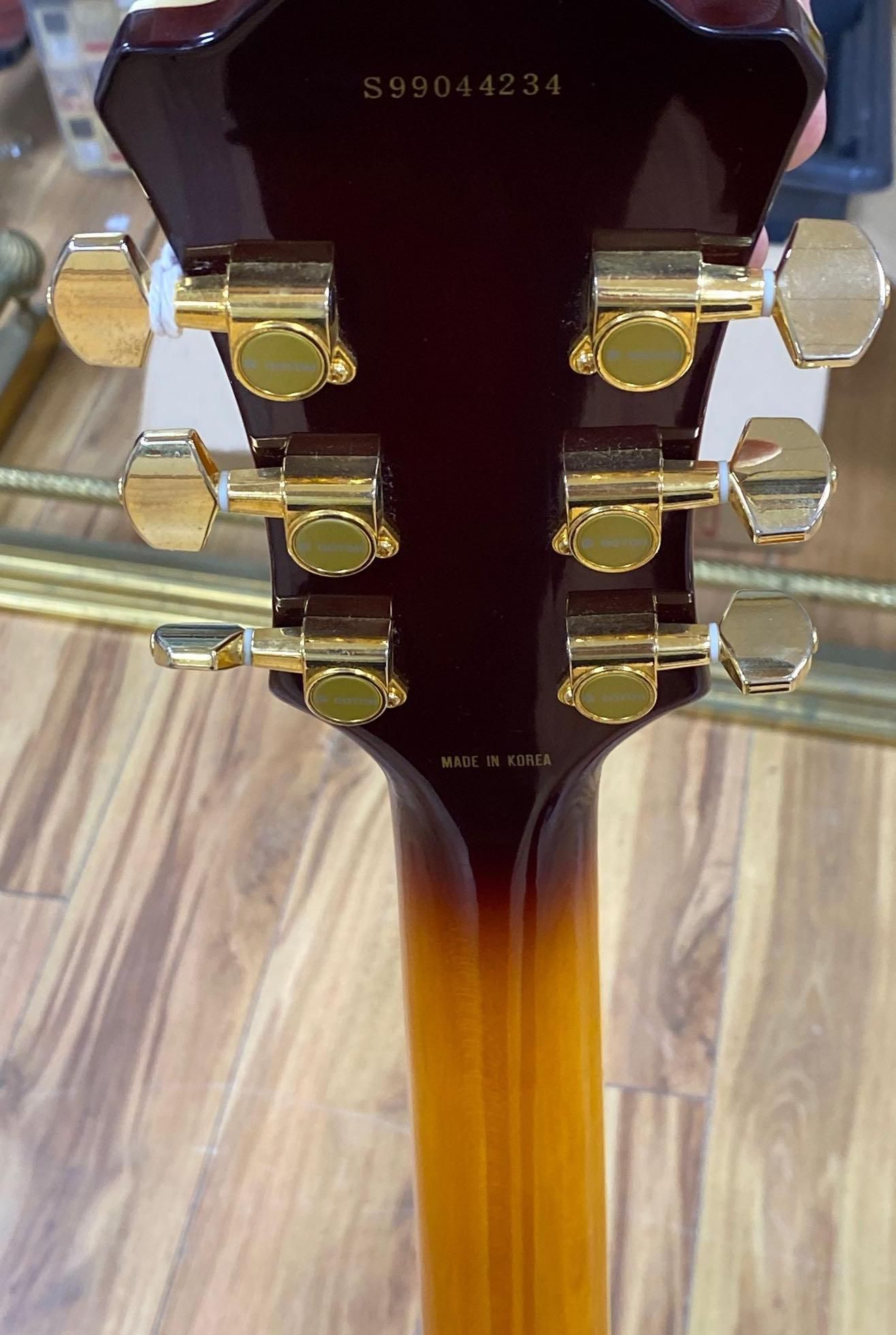 An Aria Career electric acoustic and jazz guitar, in soft case